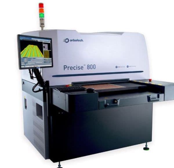 An Orbotech Precise 800 inspection system, its screen showing a magnified circuit-board layout.