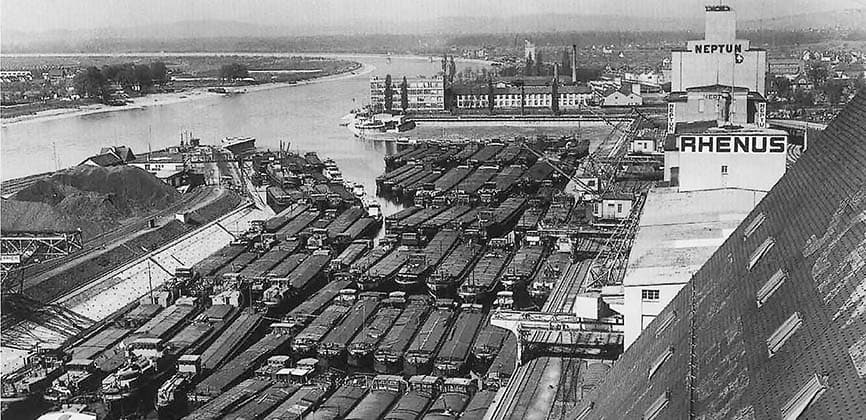 Basel's Rhine port from above: lines of rail wagons, cranes and warehouses.