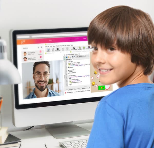 A boy at a desktop computer in a video lesson.